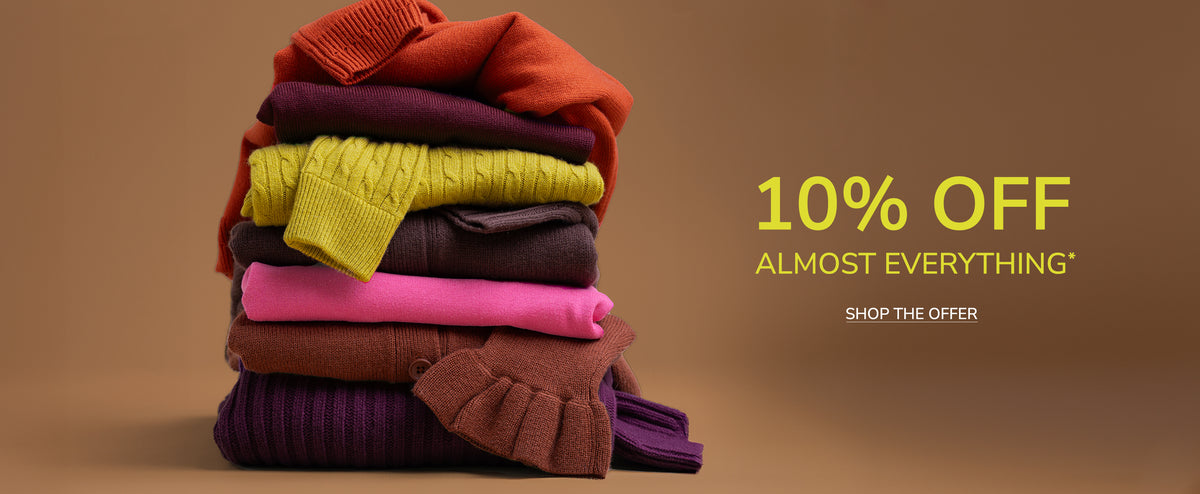 A promotional banner showing a stack of folded colorful knit sweaters on the left, with yellow text on the right reading '30% OFF ALMOST EVERYTHING' and 'SHOP THE OFFER' against a solid brown background.